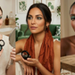 Three women with different hairstyles and makeup styles in a home setting.