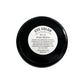 Black eye color container with a white label on a white background