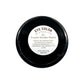 Black eye color container with a white label on a white background