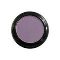Purple eyeshadow in a black compact on a white background