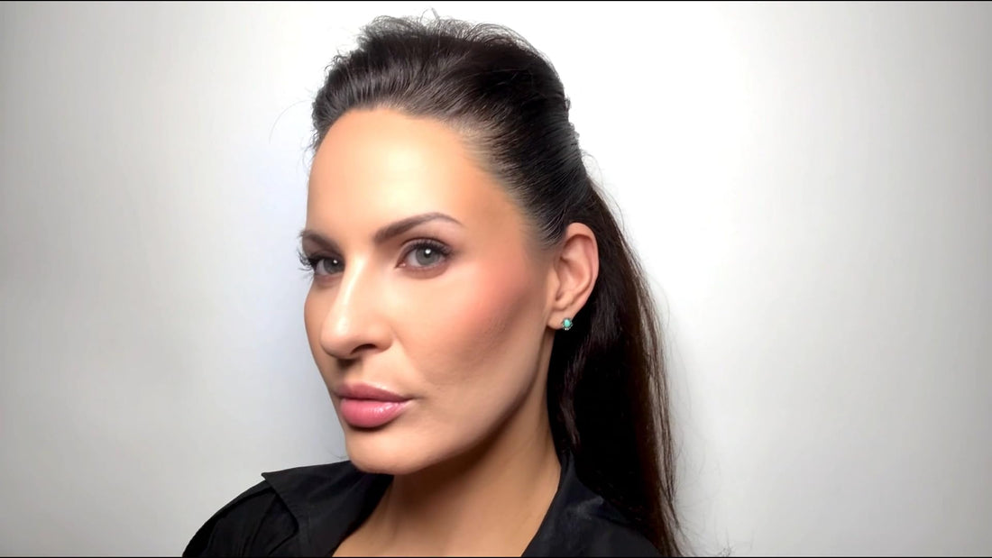 Woman with a ponytail against a plain background